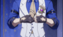 a man in a suit and tie is holding his hands together in a blurry picture .