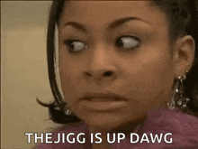 a close up of a woman making a funny face and saying `` the jigg is up dawg '' .