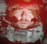 a man wearing a helmet has a patch on his chest that says ' russian ' on it
