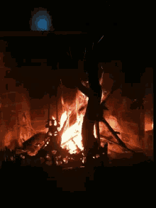 a fireplace with a lot of logs in it