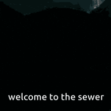 a black and white image of a man with the words welcome to the sewer below it