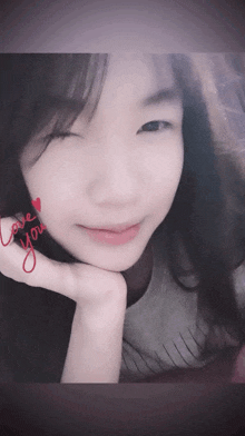 a close up of a woman 's face with the words love you written on her face