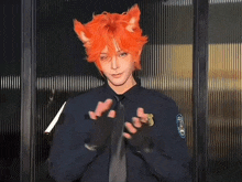 a man in a police uniform has orange hair and ears