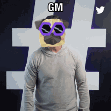 a man wearing a pug mask and sunglasses with the word gm above his head
