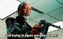 a man is holding a gun with the words still trying to figure out who you are