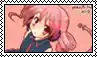 a girl with pink hair and headphones is on a stamp .