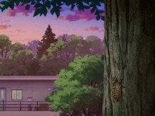 a tree with a bug on it in front of a house