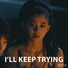a woman with dreadlocks says i 'll keep trying .