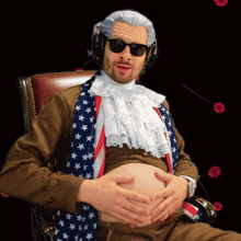 a man sitting in a chair with his hands on his belly wearing an american flag scarf