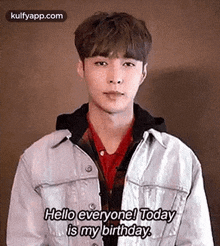 a young man is wearing a denim jacket and a red shirt and says `` hello everyone ! today is my birthday '' .