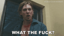 a man with blood on his shirt is asking what the fuck