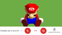 a mario video game character is sitting in front of a green screen