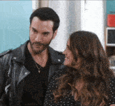 a man and a woman are looking at each other