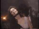 a woman is laying on top of a man in a car .