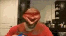 a man in a red shirt is holding a pepsi bottle in his hand .