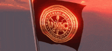 a black flag with a gold logo that says universal music community