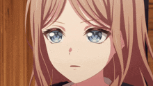a close up of a girl 's face with a blue eye