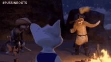 three cartoon cats are standing around a campfire with the hashtag #pussinboots on the bottom