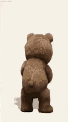 a teddy bear is holding a book and says " getting a grip on friday ... is it too early for this "