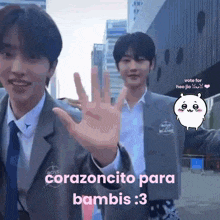 a couple of men standing next to each other with the words " corazoncito para bambi " on the bottom right