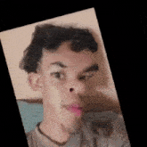 a close up of a man 's face with a very large nose and mouth .
