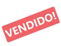 a red stamp that says vendido in white on a white background