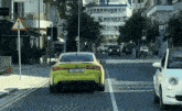 a yellow bmw with a license plate that says pnn1040