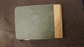 a wallet that has the letter b on the front