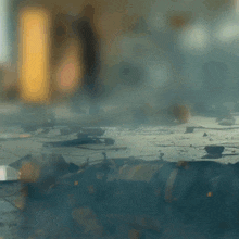 a blurred image of a room with smoke coming out of the ceiling