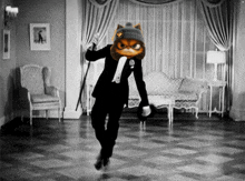 a man in a tuxedo is dancing with a cat head on his head
