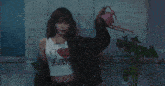 a woman in a crop top with i love nyc on it