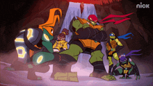 a group of teenage mutant ninja turtles standing next to each other