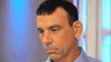 a close up of a man 's face with a toothbrush in his mouth