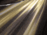 a dark background with a few rays of light