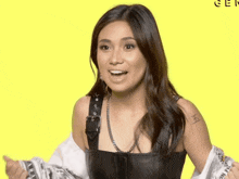 a woman with a tattoo on her arm that says e