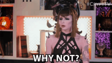 a woman in a costume says why not in front of a bookshelf