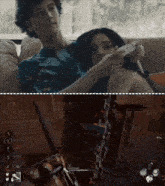 a couple sitting on a couch playing a video game