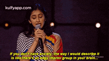 a woman is speaking into a microphone and saying if you don 't have anxiety
