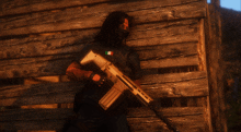 a man wearing a black shirt with a mexican flag on it is holding a gun