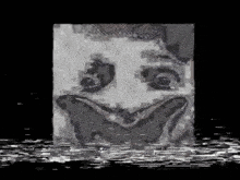 a black and white image of a spongebob squarepants face with a smile on it .