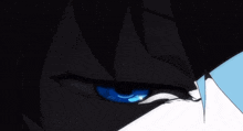 a close up of a person 's blue eye with a black background