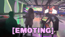 a bowling alley with the word emoting in pink letters