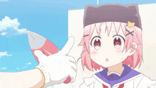 a girl with pink hair and a bear on her hat