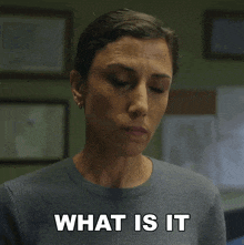 a woman in a grey sweater says that you want in white letters