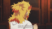 a man with long hair is sitting in front of a wooden wall and says `` bullshit '' .