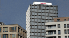 a tall building with a sign on the top that says ' allianz '