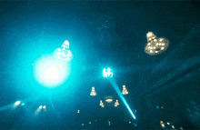 a blue light is shining from the ceiling of a building