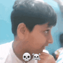a boy with two skulls on his neck looks to the side
