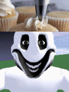 a cupcake is being decorated with whipped cream and a smiley face