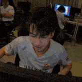 a young man wearing a white shirt that says aveep on it